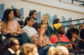 An audience listening to a debate in the Riley Smith Theatre