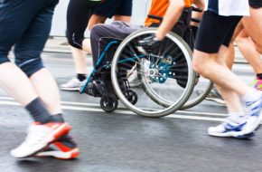 A wheelchair user taking part in a run