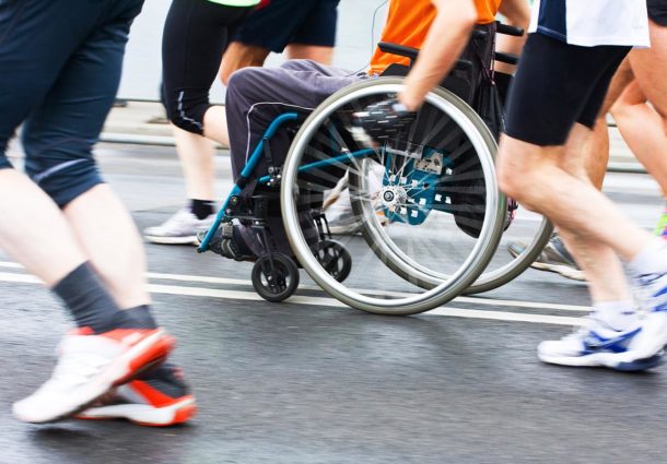 A wheelchair user taking part in a run