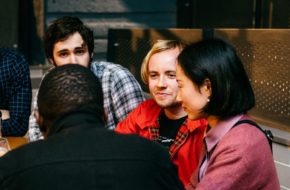 A group of Postgraduate students chatting together