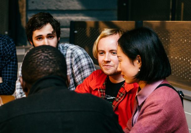 A group of Postgraduate students chatting together