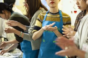 A woman rolling dough at a Culture Cooks event