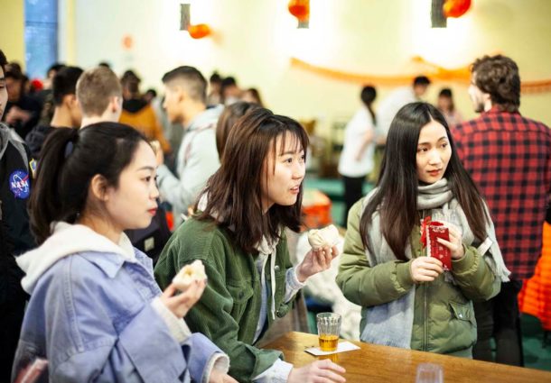 A group of students play a table game