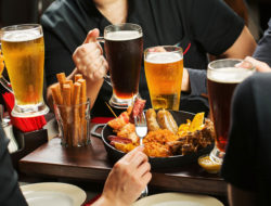 Image of several men with beer and pub fod