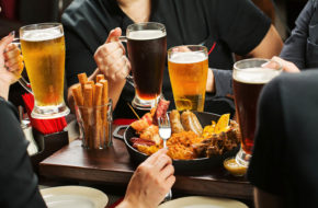 Image of several men with beer and pub fod