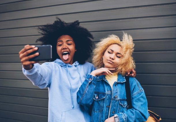 Two young women take a selfie together