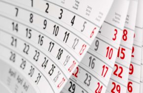 Close up of a desk calendar flicking through the months