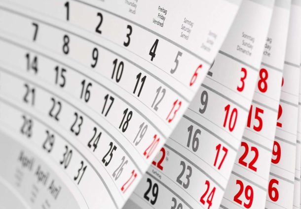 Close up of a desk calendar flicking through the months