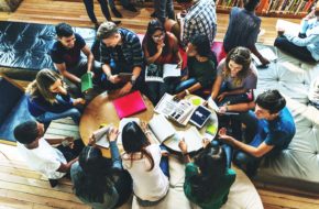 An image of several young people from above during a study session