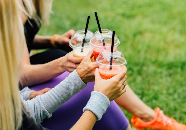 A group of friends drinking smoothies