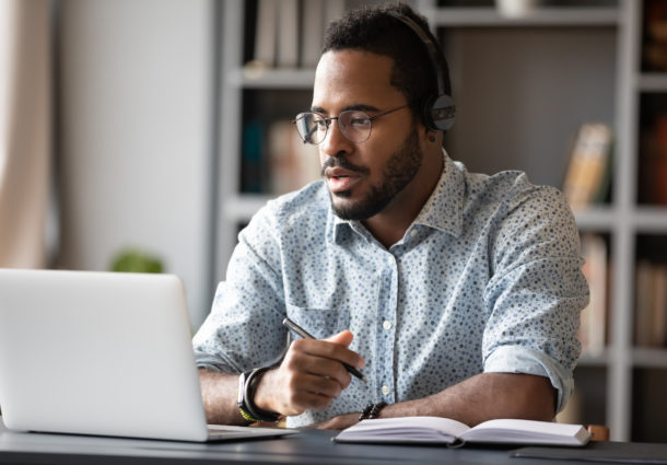 Image of a man at a laptop