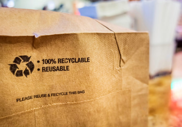 A close-up image of a recyclable brown paper bag