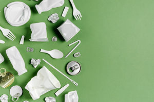 Assorted recycling on a green background