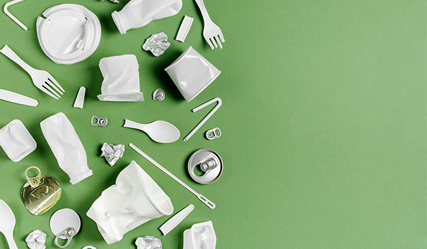 Assorted recycling on a green background