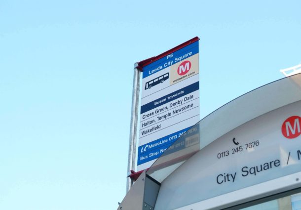 A Leeds City Square bus stop sign post